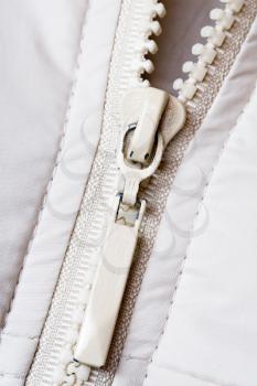 Royalty Free Photo of a Zipper on a White Jacket