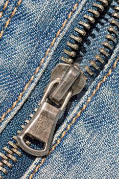 Royalty Free Photo of a Zipper on Blue Jeans