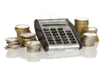calculator and stack of coins with reflection on white background