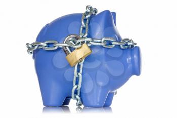 Financial insurance. Piggy bank secured with padlock and chain.