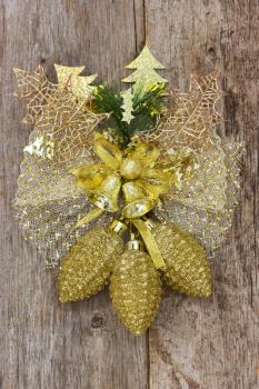Golden christmas decoration hang on the wooden wall