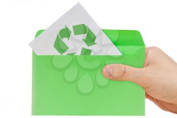 Hand holding ecology envelope with symbol of recycling