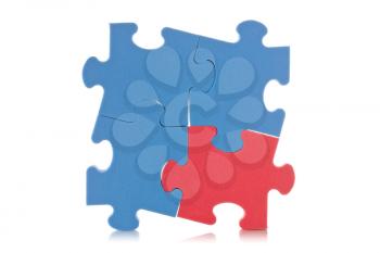 blue puzzle sign with one red piece