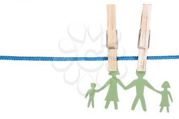 Paper family on the clothesline, isolated over a white background