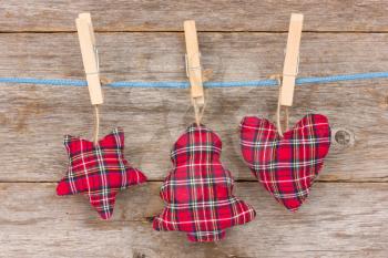 Christmas decoration hang over a wooden background 