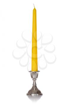 Yellow candle isolated on the white background