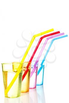 Colorful drinks with straws, isolated on white background