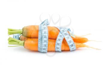 Carrot wrapped by measure tape on the white background