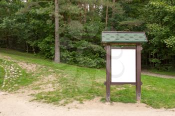 Blank  billboard in the green forest. Can be used for your text or image