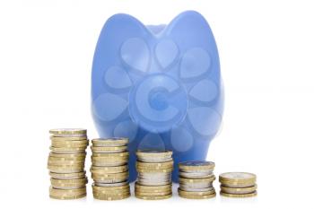 Blue piggy bank and money coins stair isolated over the white background 