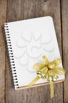 Royalty Free Photo of a Blank Notebook and a Christmas Decoration