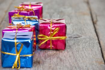 Royalty Free Photo of Glossy Gifts on Wood
