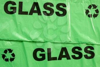Background of yellow garbage bags for recyclable glass