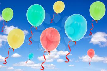 Many balloons fly into the blue sky 
