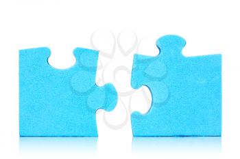 Connection metaphor. Two  pieces of blue puzzle on white background 