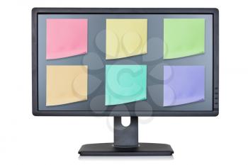 Computer monitor with color note papers , isolated on white background 