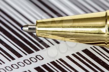 Close up view of pen on barcode background