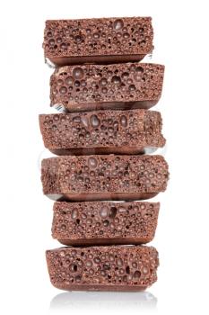 Stack of chocolate pieces on a white background 