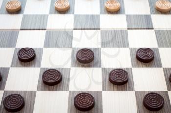 Detailed photo of the checkers board game