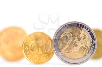 Extremely close up view of Euro currency over a white background