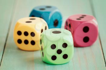 Dices on wooden floor in vintage color tone. Abstract background to risk management concept