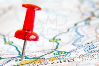 Red pushpin on a tourist map. Travelling, and tourism concept