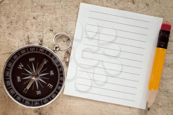 Old compass,pencil and blank paper for your text