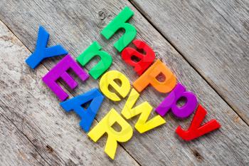 Happy New Year written in a colorful plastic letters