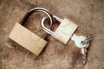   Two linked padlocks symbolizing togetherness or relations