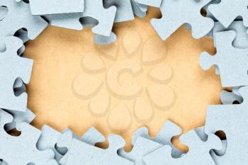 Blue jigsaw frame with paper background for copy-space