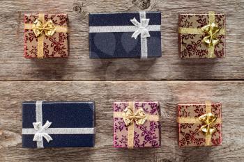 Six gift boxes on old wooden  background