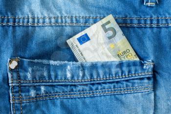 Brand new five euro in jeans pocket
