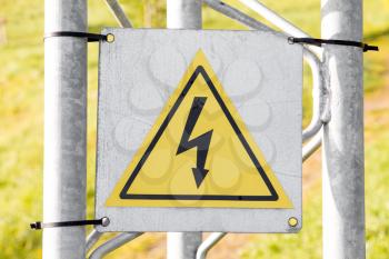 High voltage warning sign on metal construction