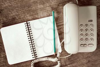 Touch tone telephone and blank notebook for your text