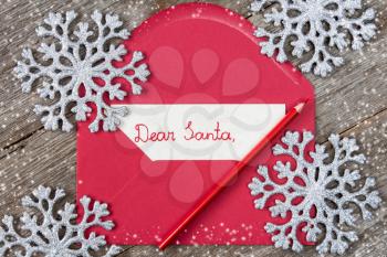 Child's letter to Santa in a red envelope