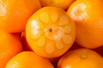 Food background of fresh healthy ripe orange clementines, tangerines or mandarins
