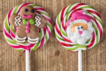 Christmas lollipops with gingerbread man and face of Santa