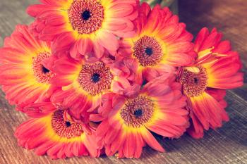 Beautiful bouquet of gerbera flowers on the wooden table