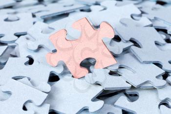 Jigsaw puzzle pile. Stand out from the crowd concept or be different