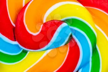 Colorful spiral lollipop close up. Texture of big round lollipop for background