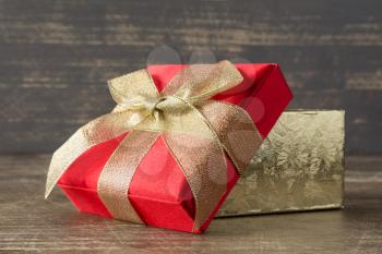 Holidays concept. Present box on wooden background. 
