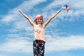Little girl  holding an american flag