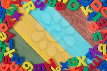 Border of colorful letters and numbers with copy-space