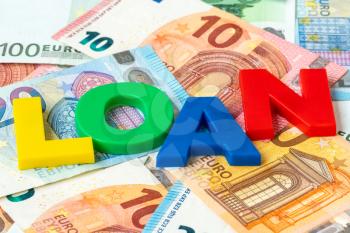 Euro currency and word LOAN made from colored plastic letters