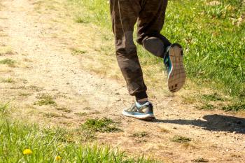 Runner man running on a rural road. Healthy or active life concept