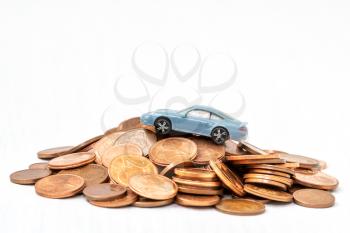 Car model and coins.Saving money for a car.Copy-space.