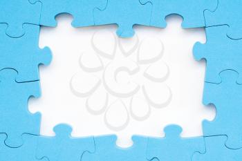 The frame from blue puzzle on white background for your text