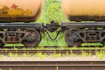 Oil tanker cars on the railway cargo station on a summer day