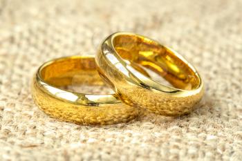 Wedding rings, on a old fabric background