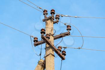 Insulators power lines against the sky background